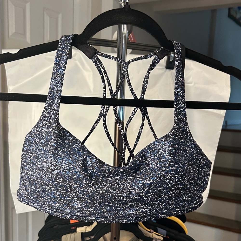 Lululemon EUC HAS A Speckled Sports Bra with Strappy Back SIZE 10 with pads.